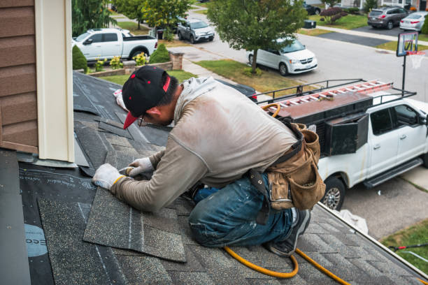 Professional Roofing technician working in Great River, NY